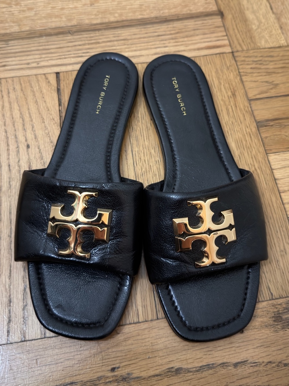 Tory Burch Black Leather Slide Mules with Gold Logo Plaque